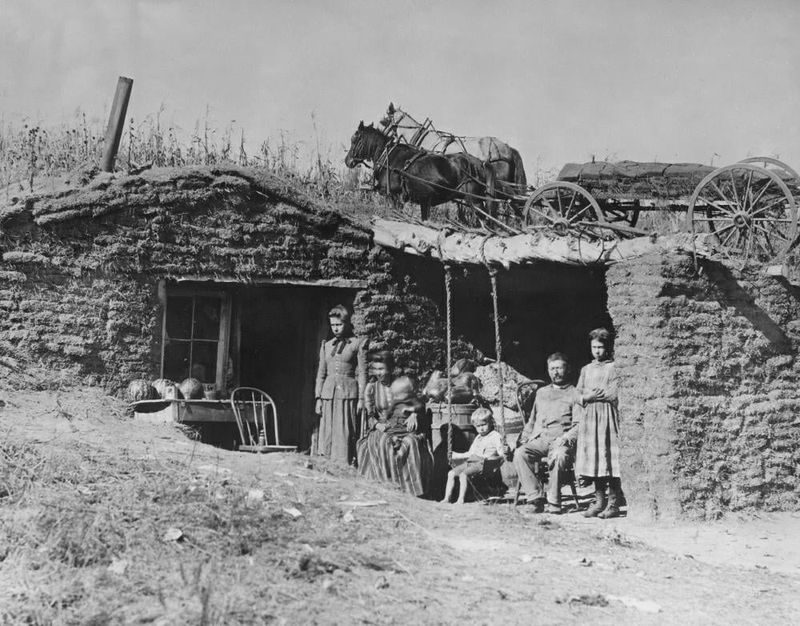 A Nebraska homesteader family outside their home in 1892